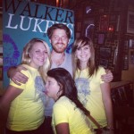 Walker Lukens posing with fans while on tour.